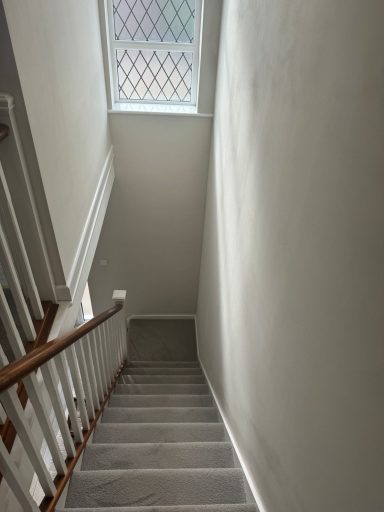 Hall, stairs and landing with window