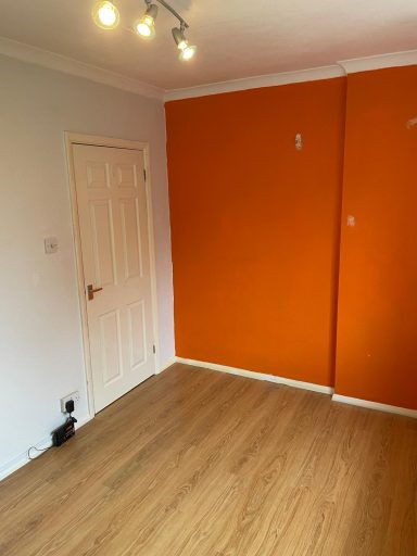 Before Picture of Bedroom with Orange Feature Wall